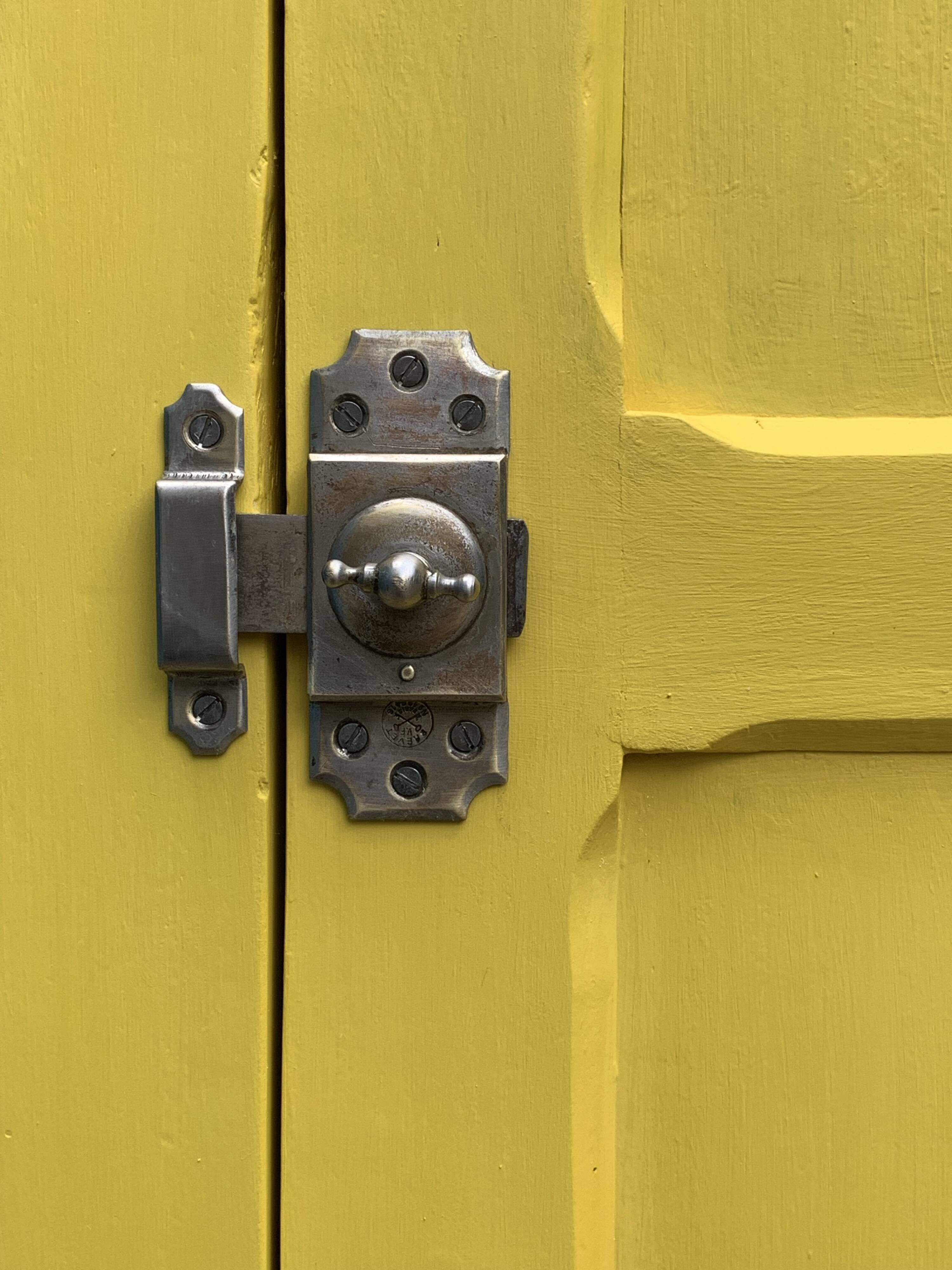 Antique powder yellow Parisian bonnetière wardrobe.