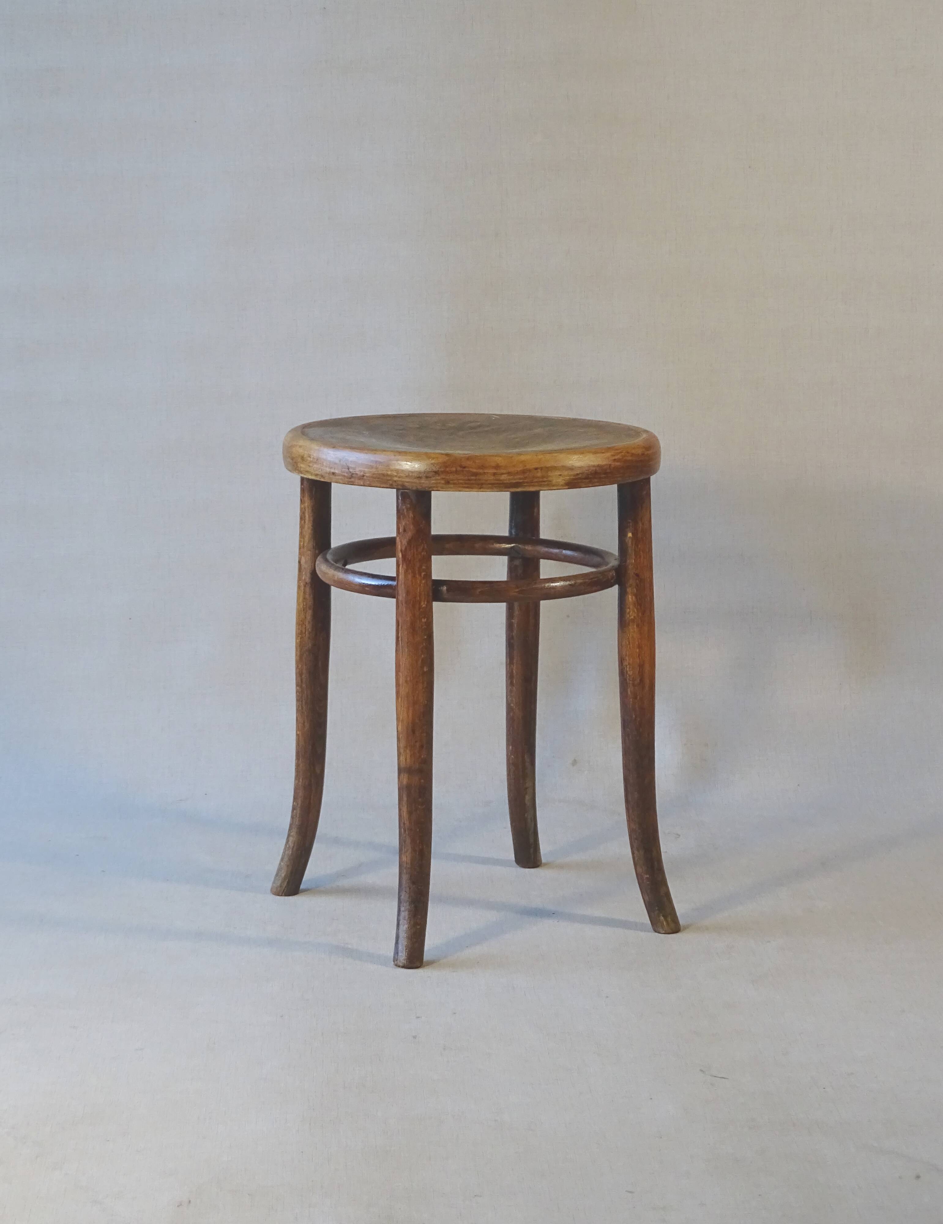 Low stool with wooden seat, circa 1930