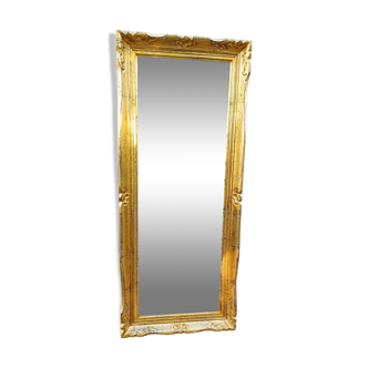 narrow gilded mirror in Louis XV style