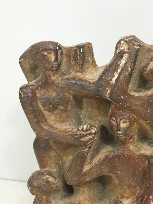 Plaster sculpture depicting a group of 3 figures