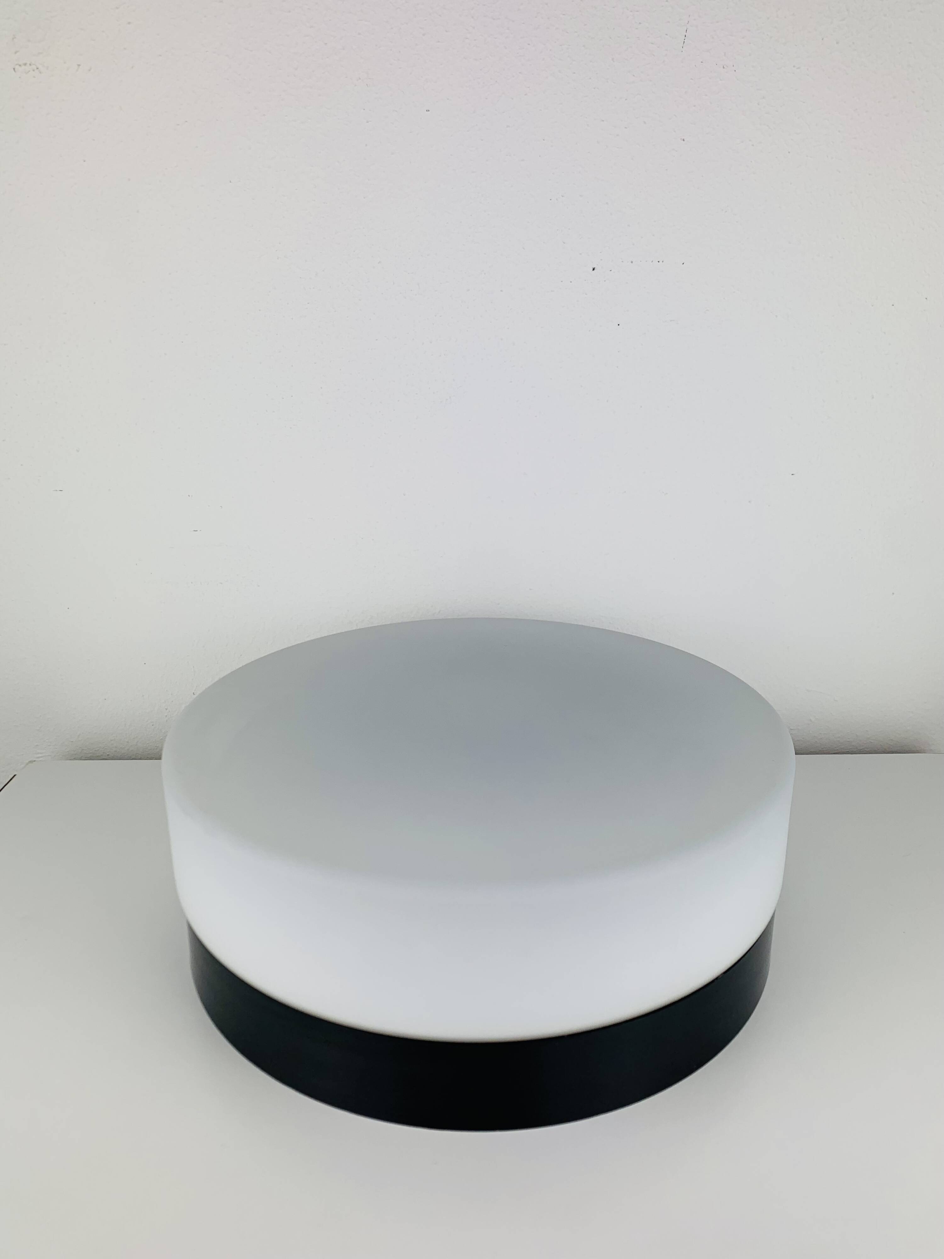 Erco round opaline wall light from the 1960s