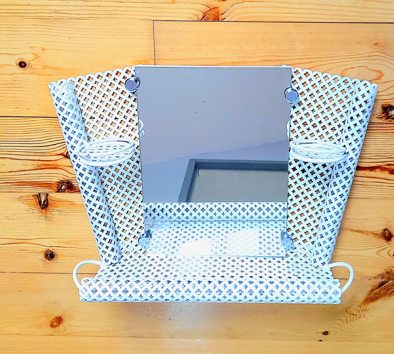 Perforated sheet metal bathroom shelf