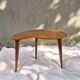 Vintage Scandinavian bean side table with wooden tapered legs.