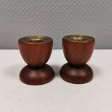 Two beautiful teak candle holders with brass inserts.
