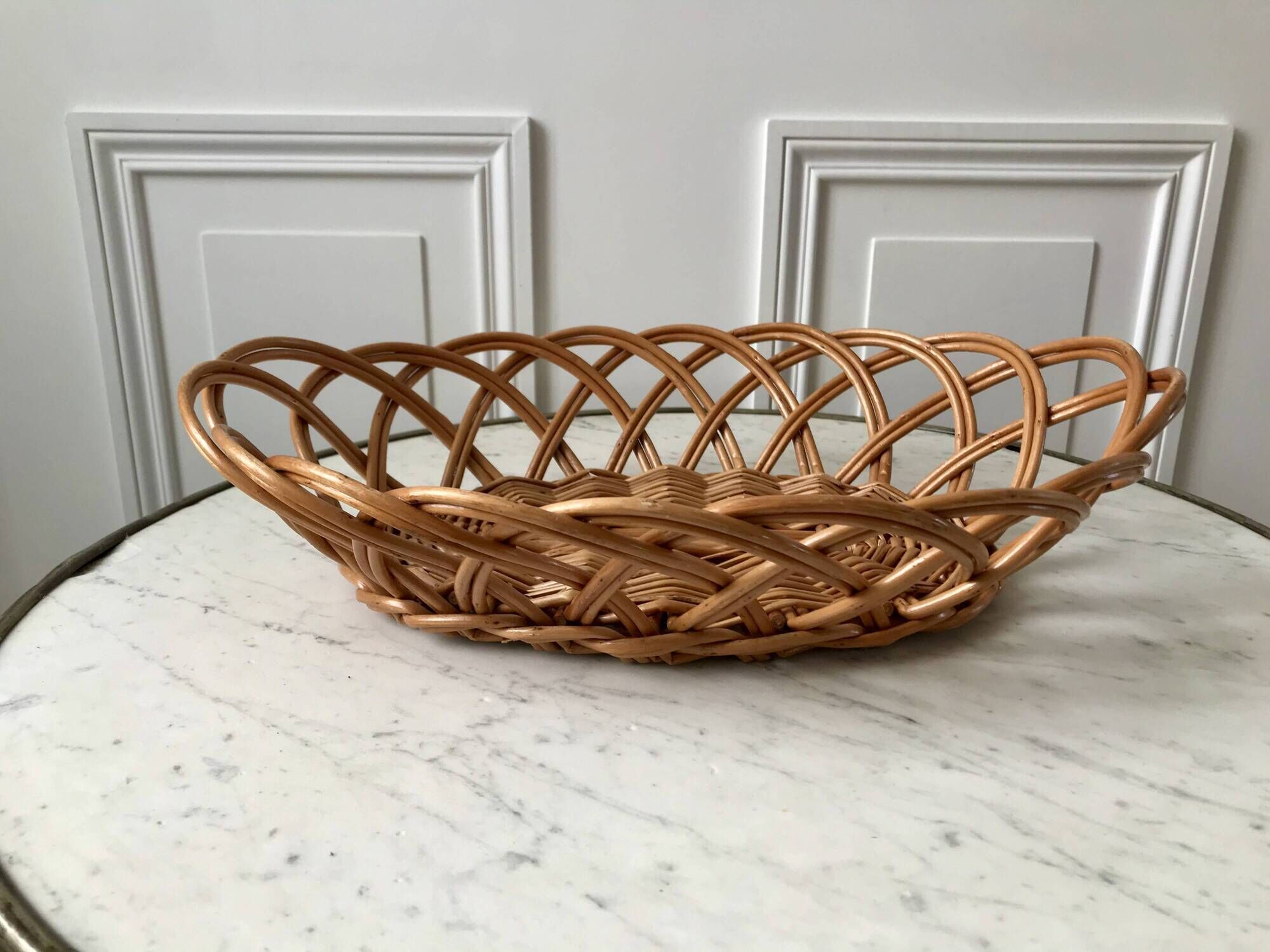 trio of woven rattan and bamboo baskets from the 60s and 70s