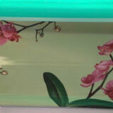 Cake dish with fuchsia orchids