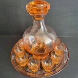 Liquor service in pink moulded glass