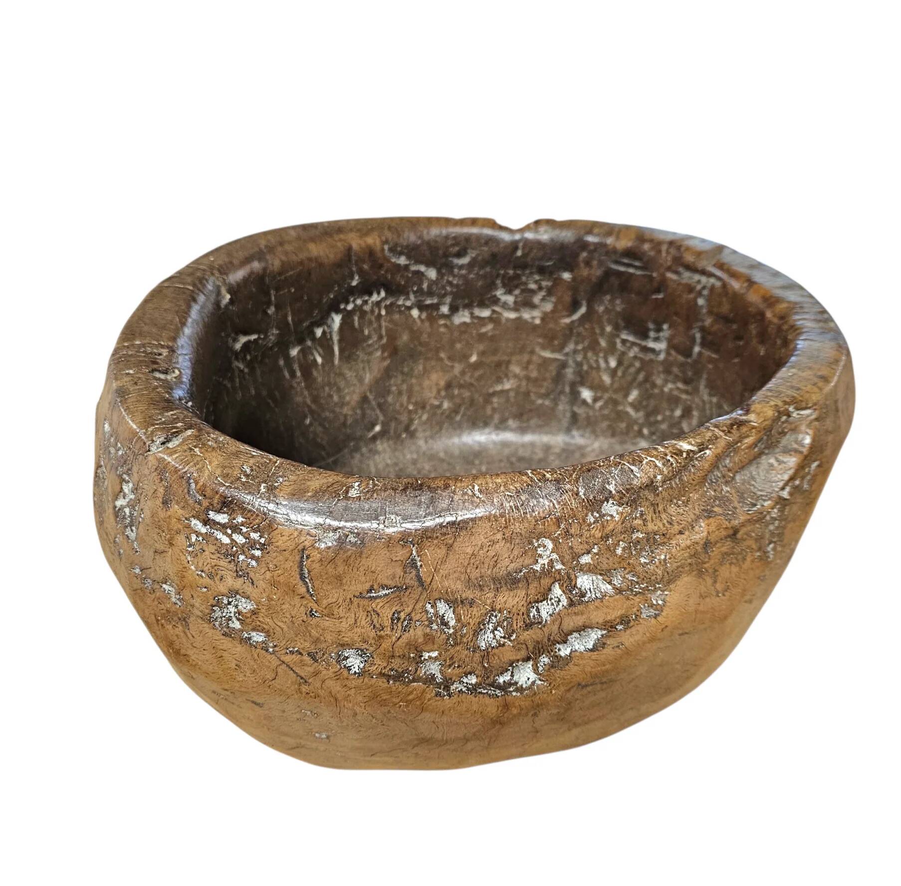 A substantial hand-hewn wooden bowl carved from a single burl section