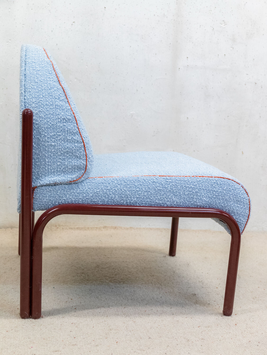 Souvignet armchair reupholstered in sky blue boucle.