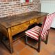 Antique desk accompanied by its chair – first half of the 18th century.