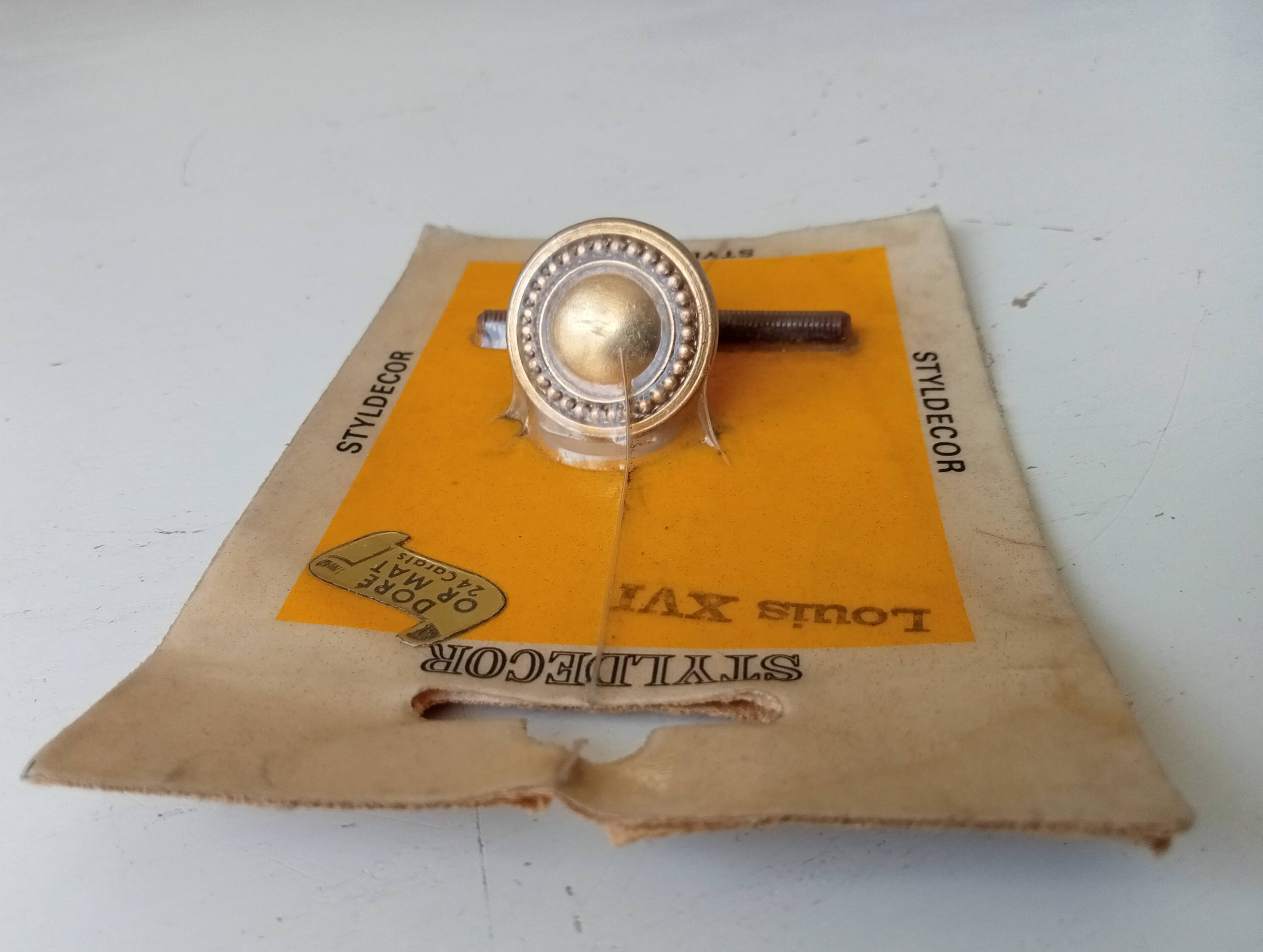 Vintage furniture knob in Louis XVI style, gilded with fine gold.