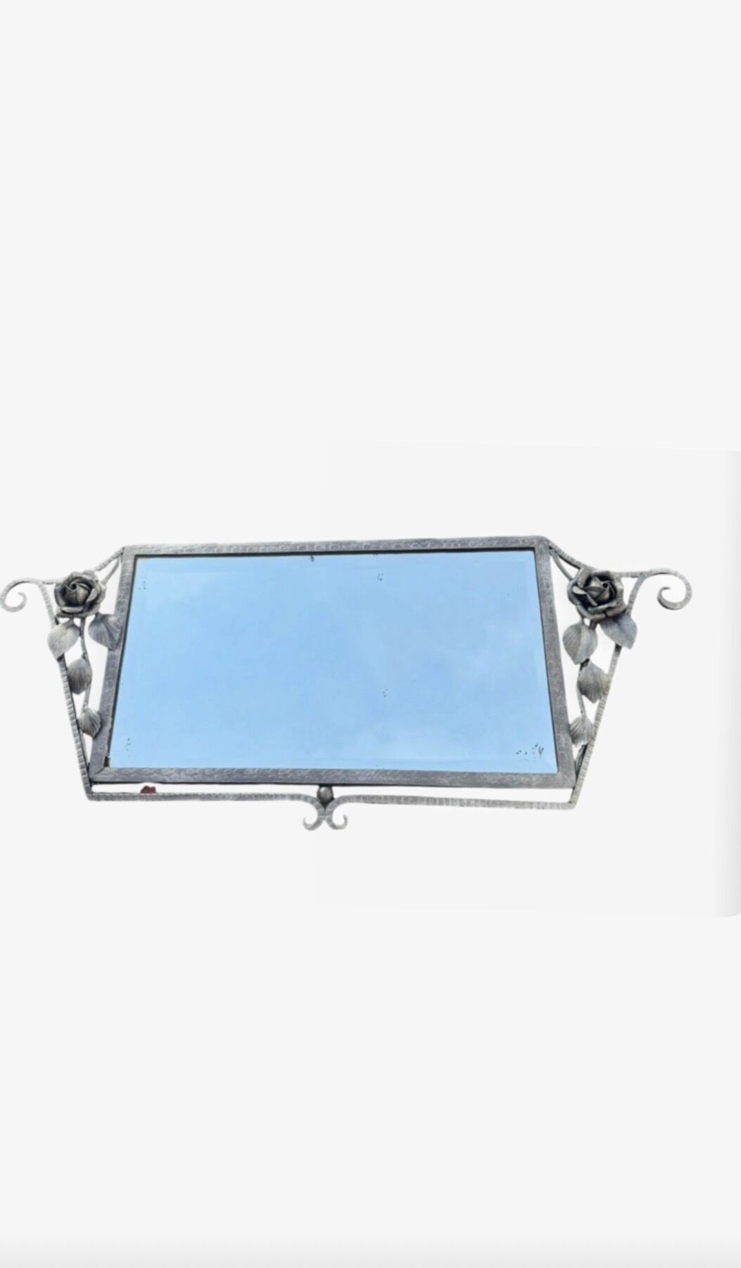 Art Deco mirror from the 1930s in silvered wrought iron, decorated with roses.