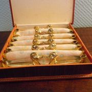 Box of 12 knife holders in silver metal, shape of canrds, 60s