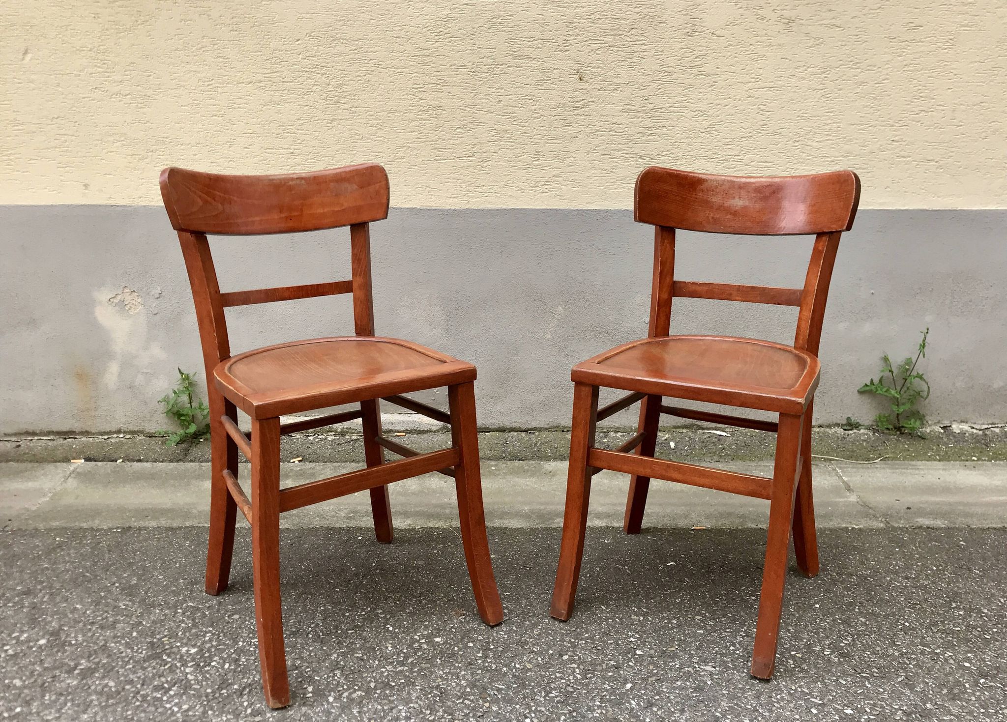 Pair of wooden bistro chairs with orange patina, 1950s