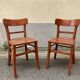 Pair of wooden bistro chairs with orange patina, 1950s