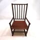 Fauteuil Manou en rotin et assise en cuir, 1960