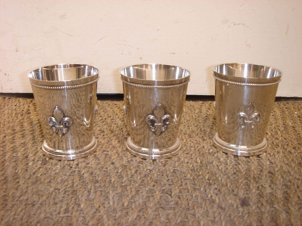 3 silver cups, lily flower