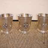 3 silver cups, lily flower