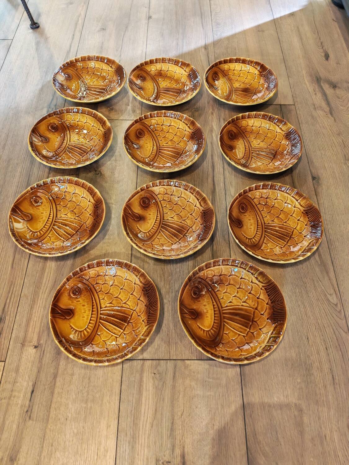Vintage barbotine plates with fish decoration, 22 pieces.