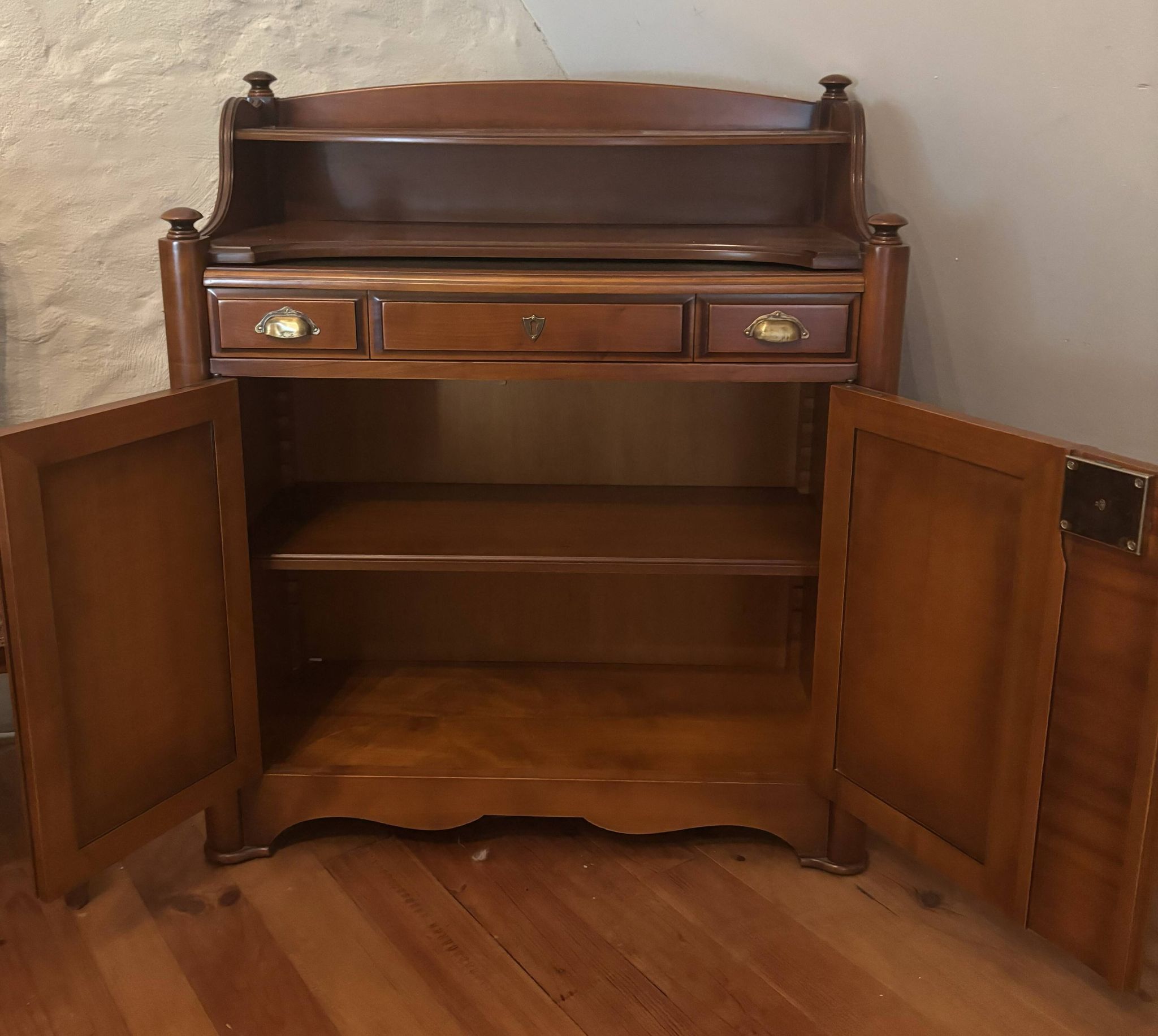 Vintage drop-leaf secretary with a green leather top and inlays.