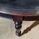 Large English library table in dark walnut with a leather top.