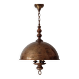 Rustic old wooden and brass suspension.