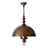 Rustic old wooden and brass suspension.