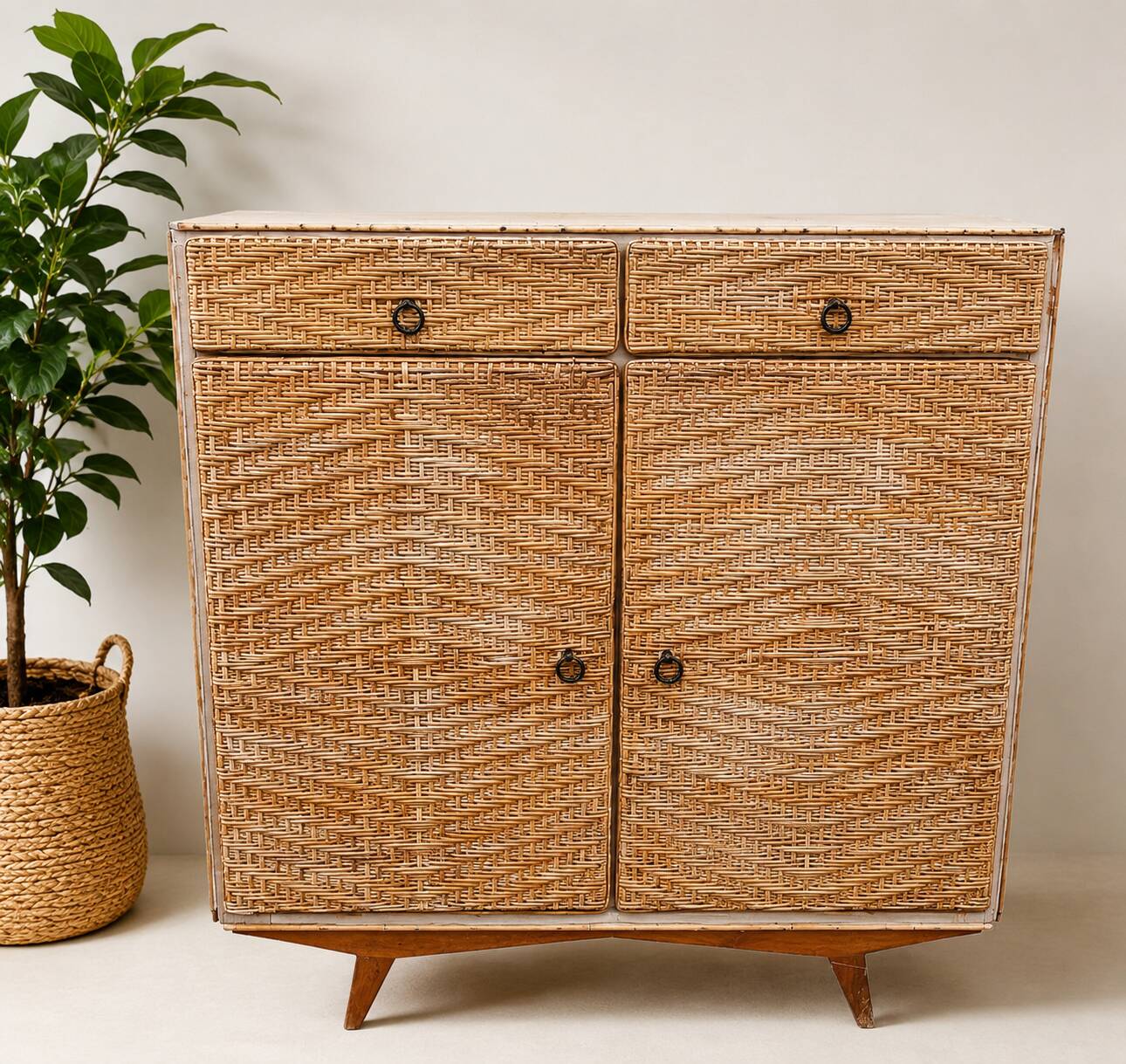 Vintage woven rattan furniture with tapered legs.