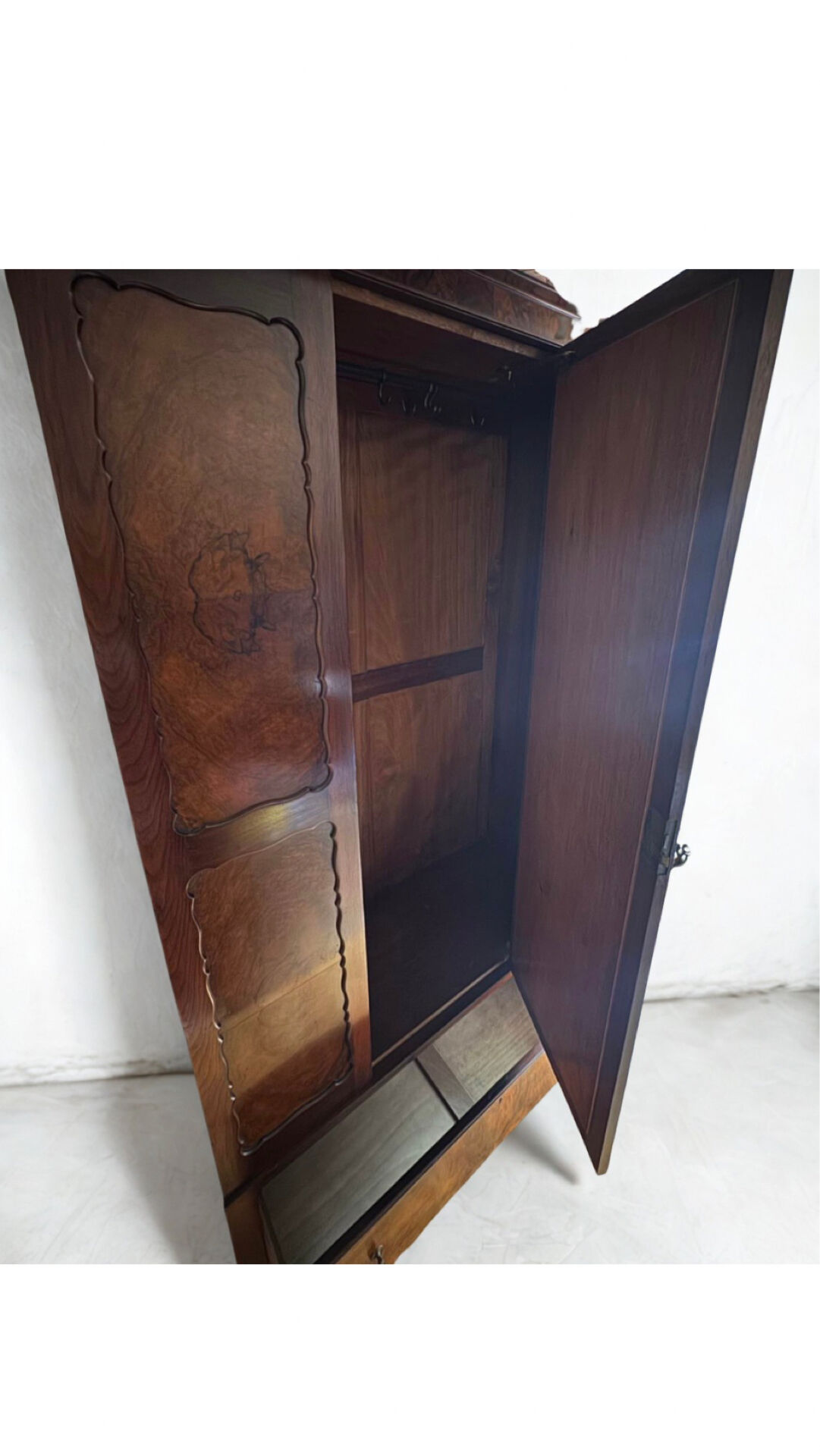 Antique walnut burl wardrobe with central mirror and large drawer.