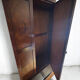 Antique walnut burl wardrobe with central mirror and large drawer.