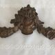 Old brass pediment, floral motifs and ribbon