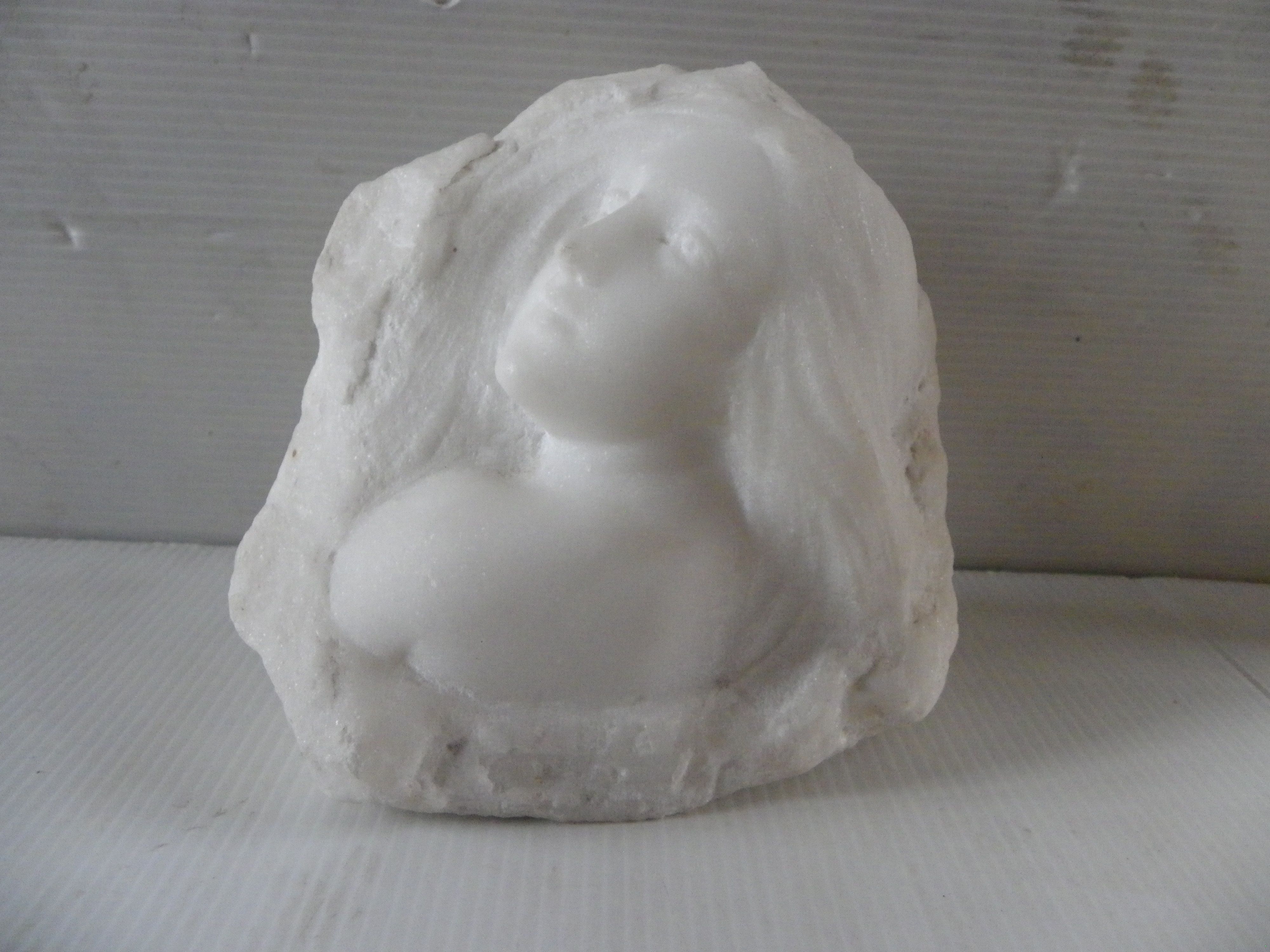 Sculpture face of woman in marble block 13 x 12 x 8 cm