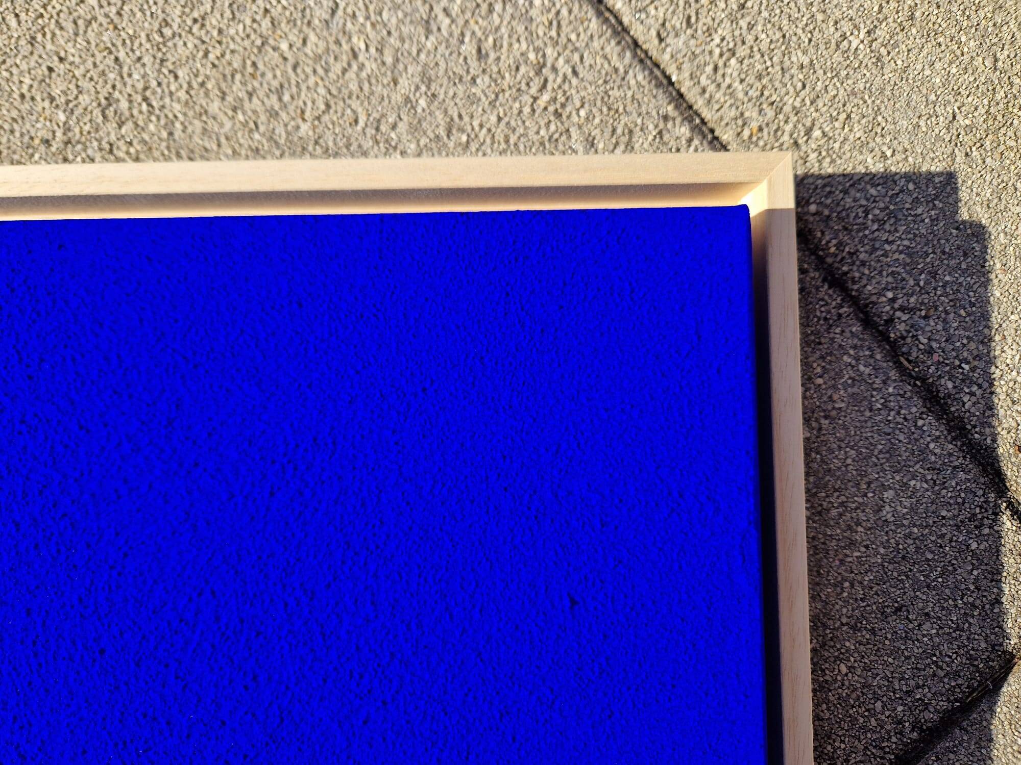 Framed monochrome blue abstract painting.