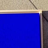 Framed monochrome blue abstract painting.