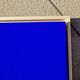 Framed monochrome blue abstract painting.