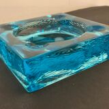 Ashtray paved in blue glass