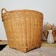 Storage basket for a plant pot in vintage rattan