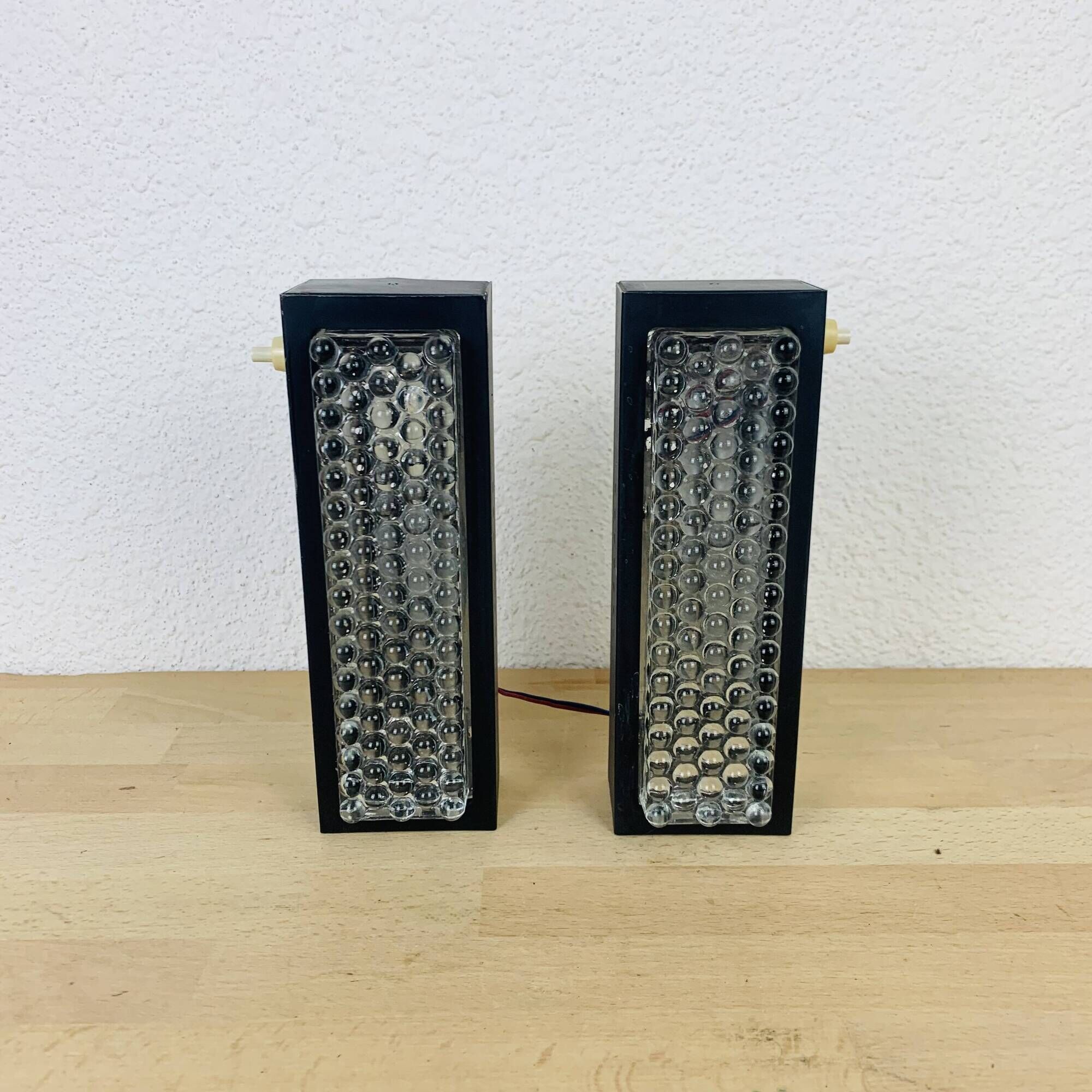 Pair of molded glass and metal wall lights from the 1950s