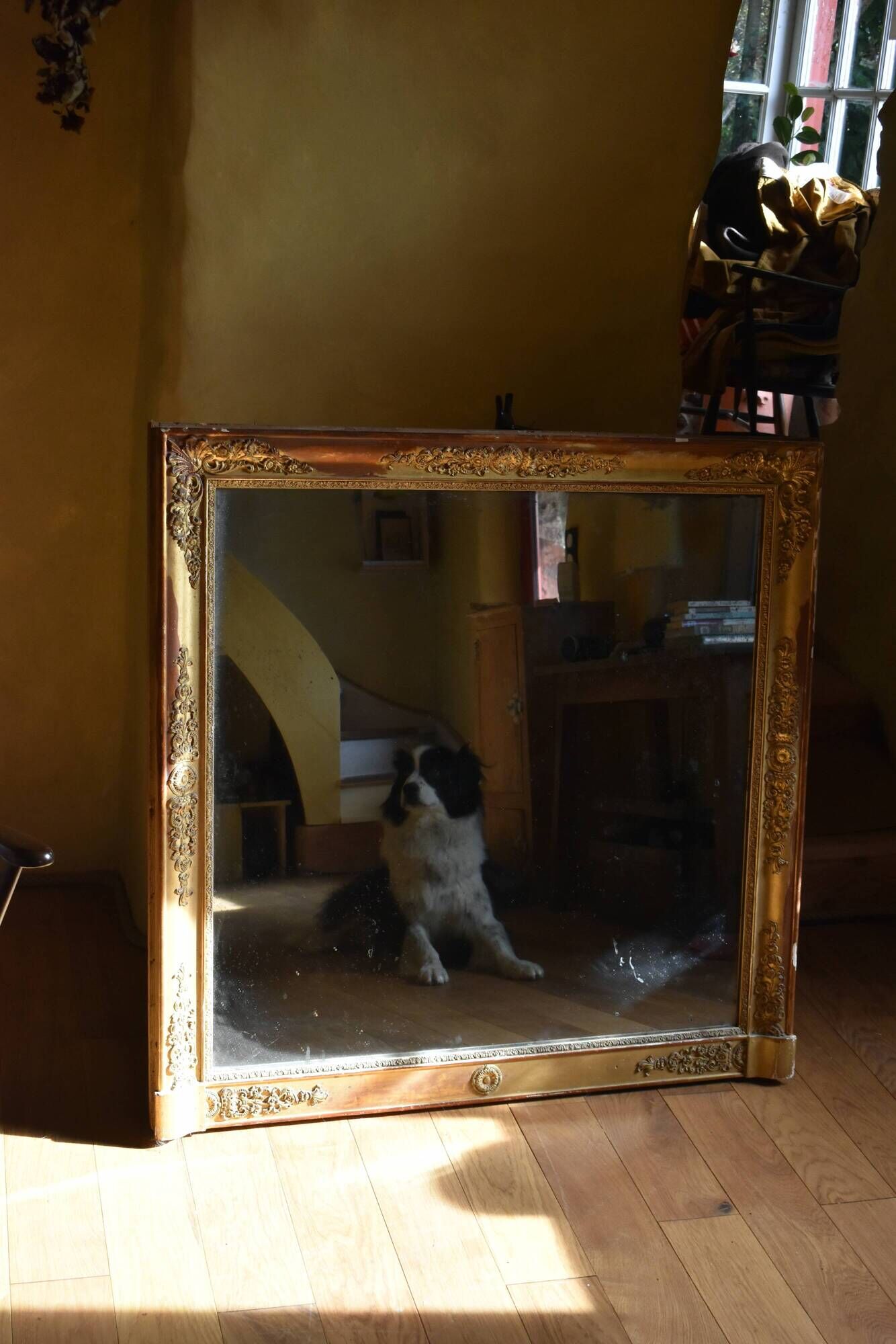Large gilded Empire mirror from the 19th century.