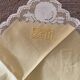 Tablecloth and 12 straw-colored napkins from the 50s.