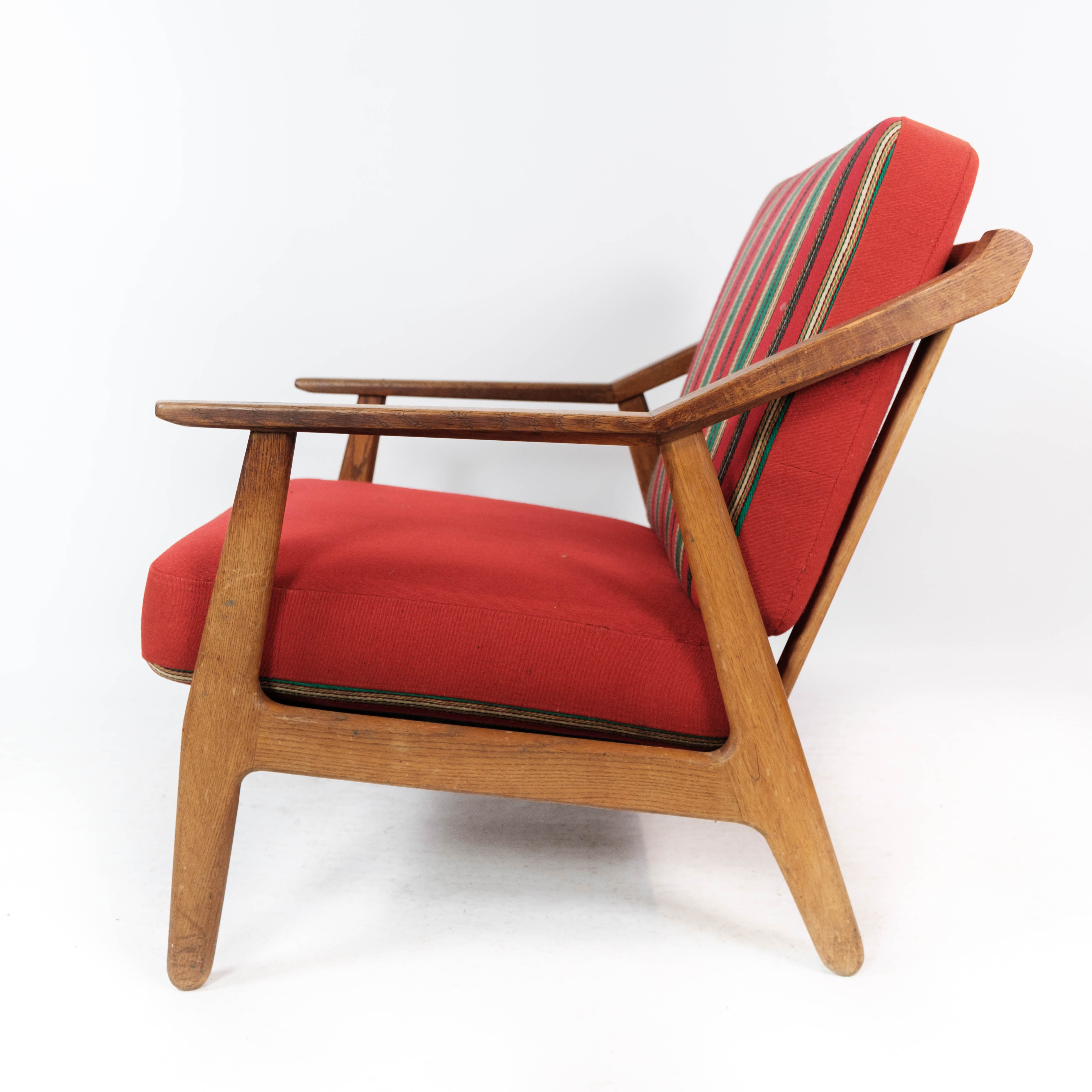 Armchair in oak and upholstered with red fabric, designed by H. Brockmann Pedersen, 1960s