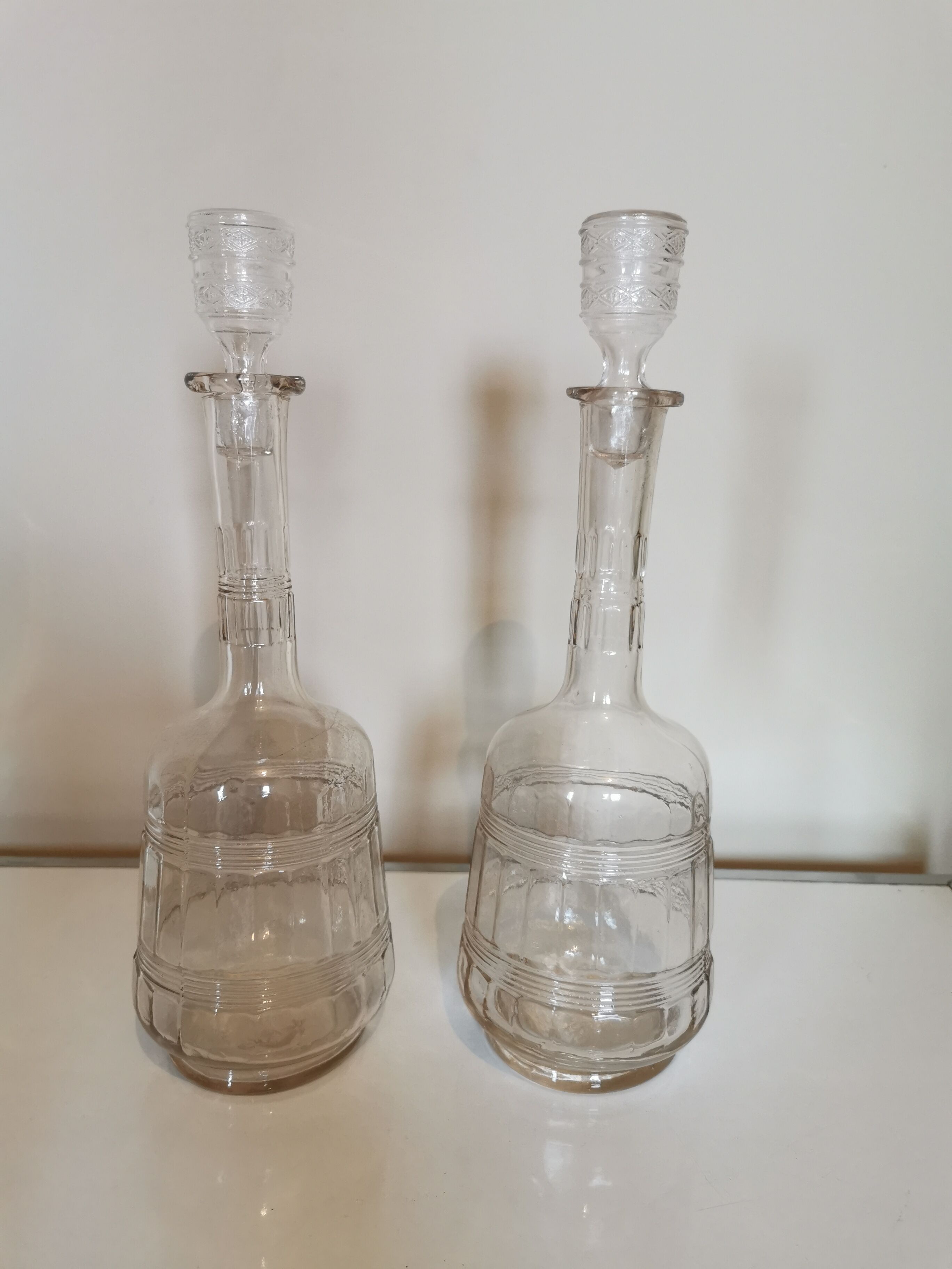 Pair of antique moulded glass decanters