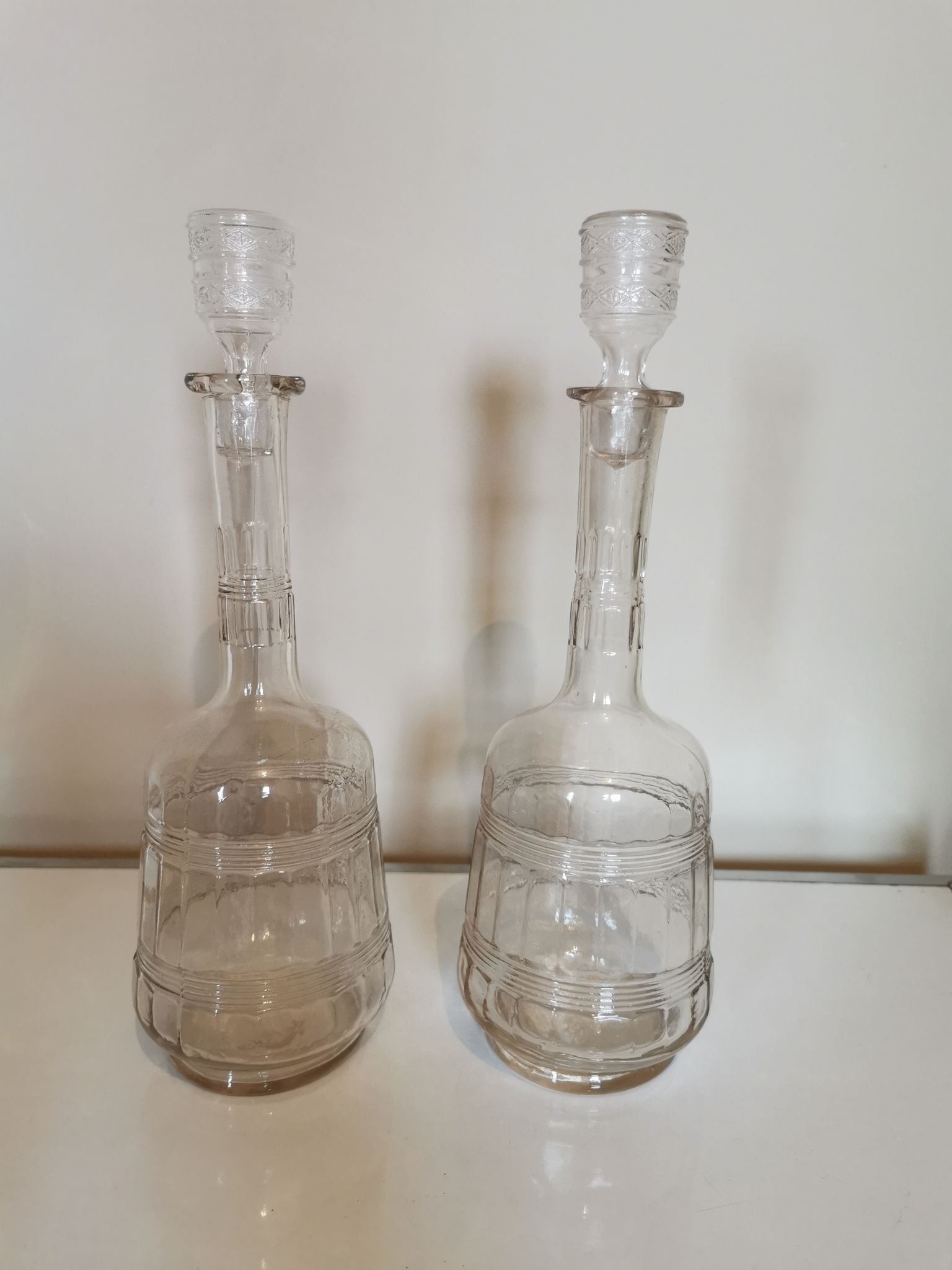 Pair of antique moulded glass carafes