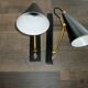 Pair of modernist sconces in black and gold metal