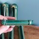 Poët Laval knife rest in emerald green ceramic and gold.