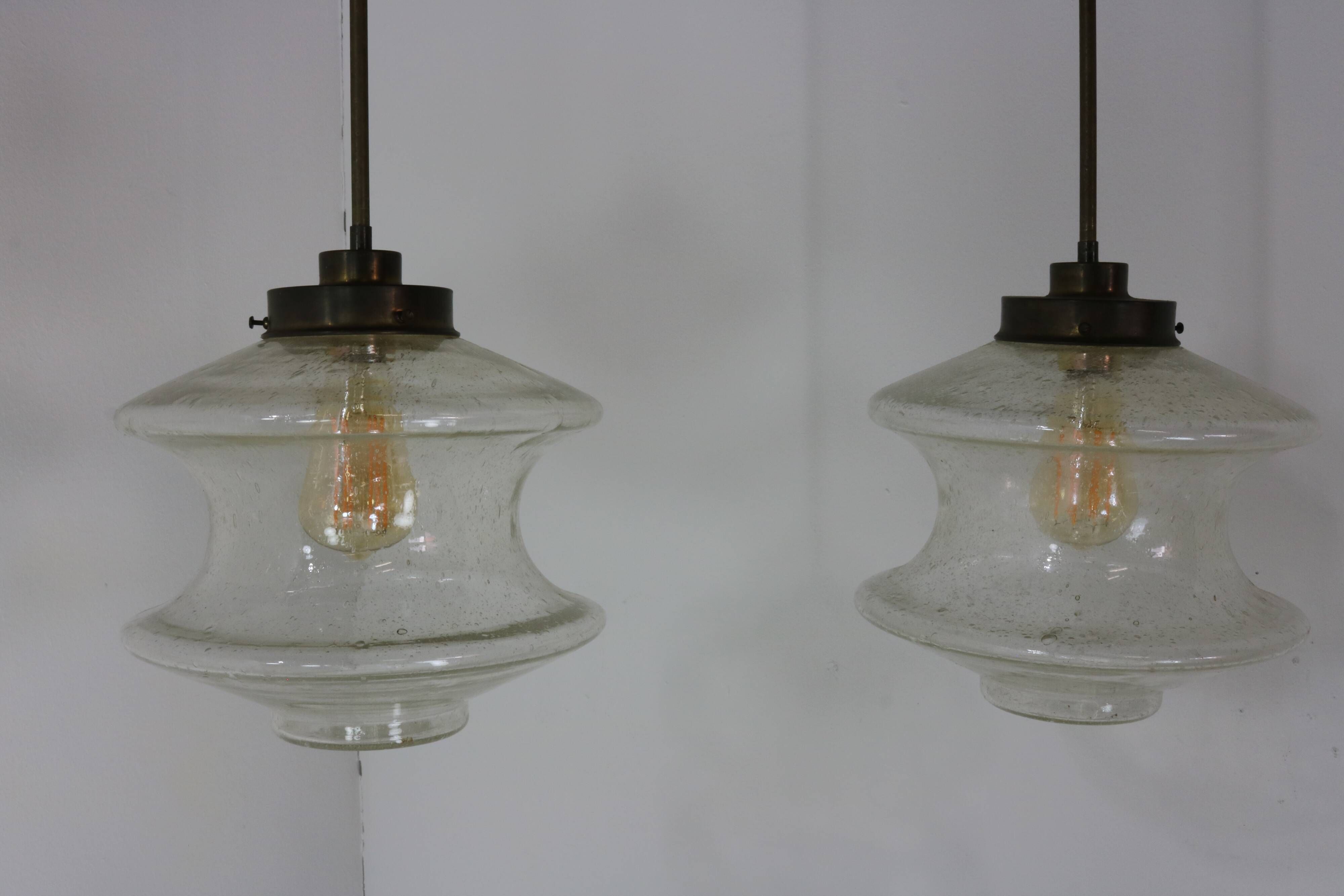 Set of two glass pendant lighting designed by Raak Holland