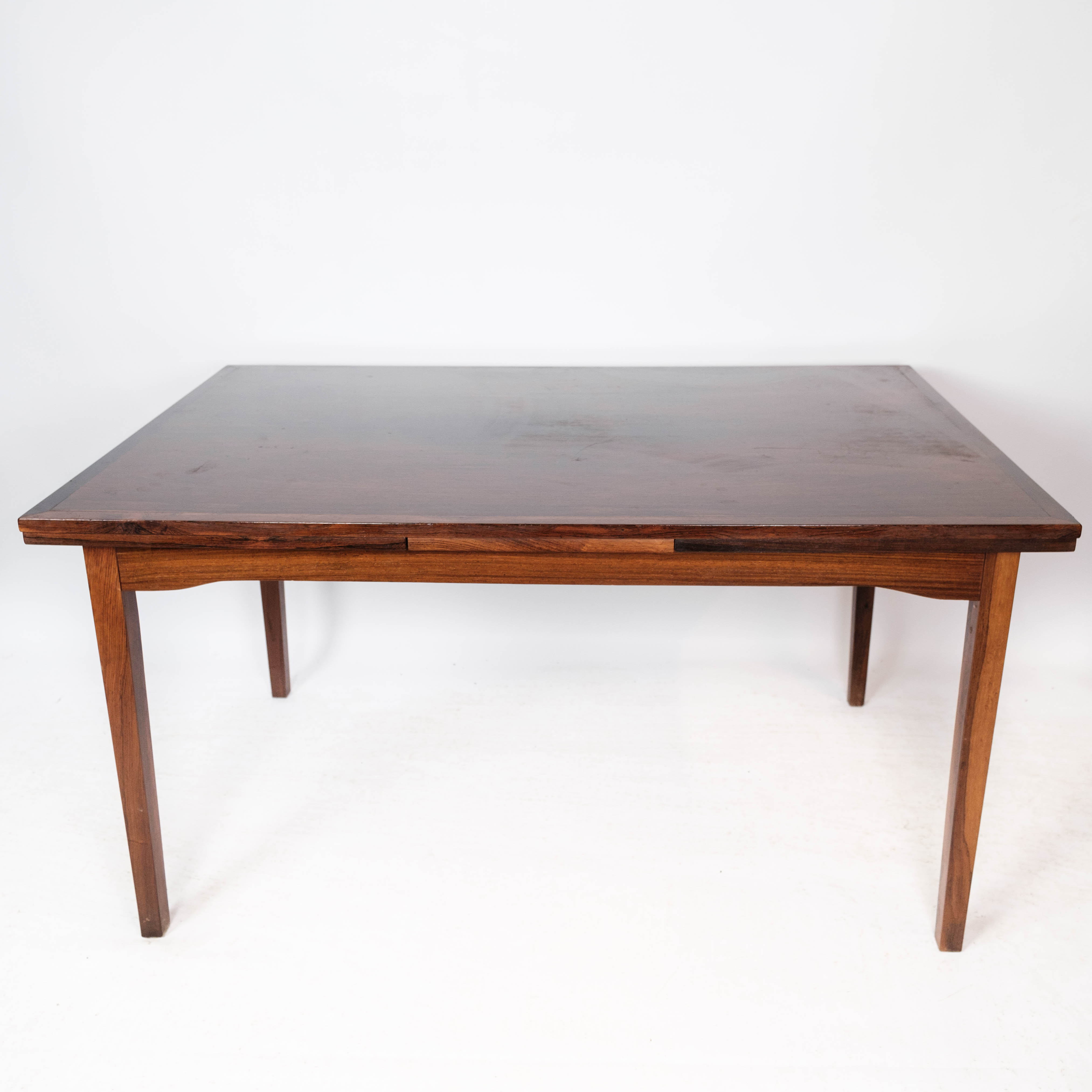 Dining table in rosewood with extension, of Danish design by Ellegaards Furniture, 1960s