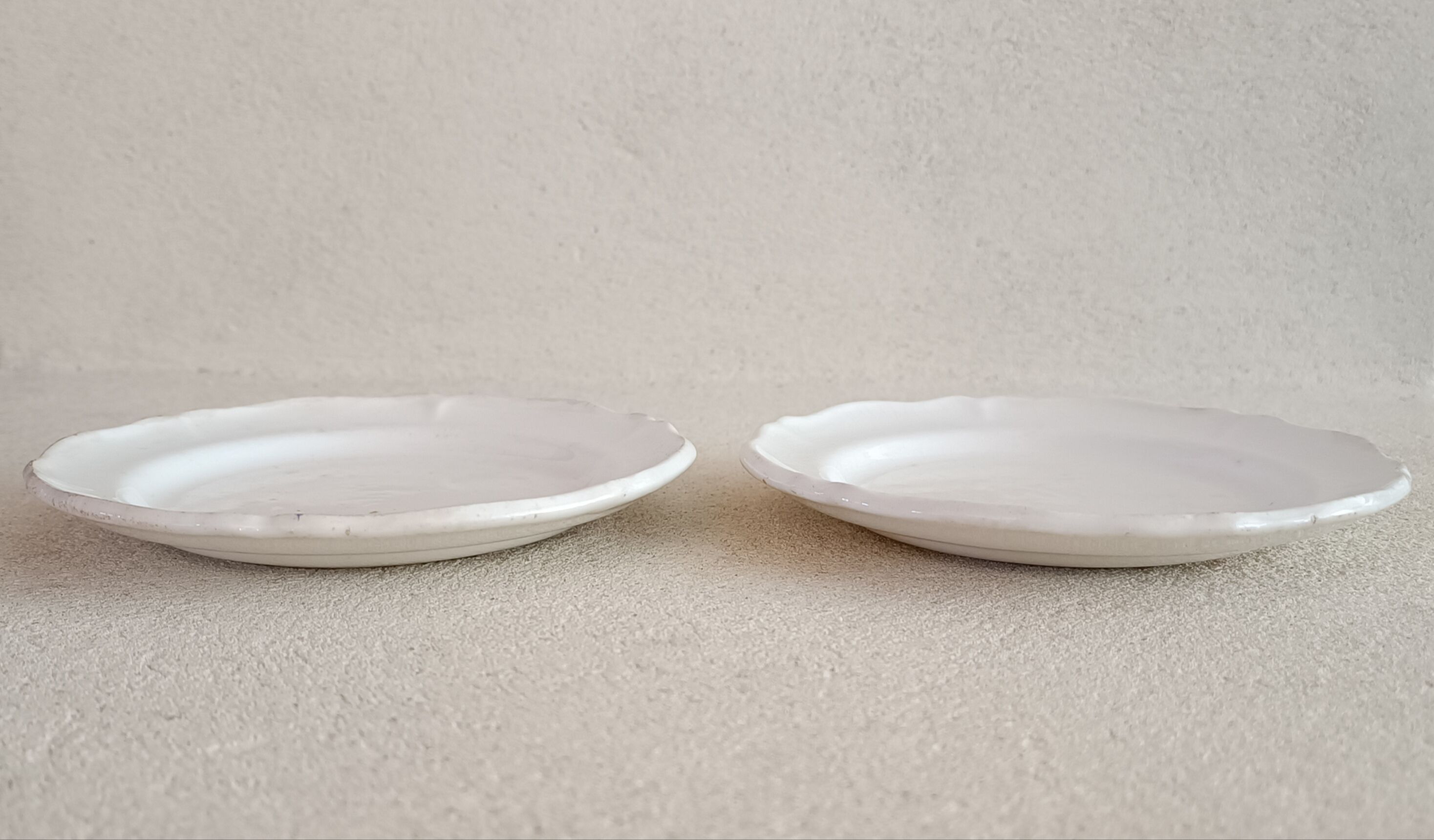 2 ivory plates with godrons