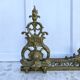 Antique brass fireplace set, bar and andirons, Napoleon I style.