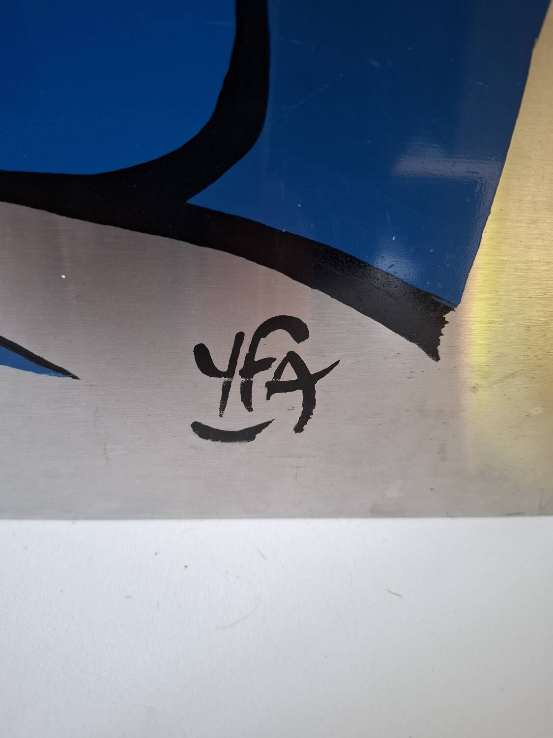 Silkscreen on brushed aluminium from the 1970s.